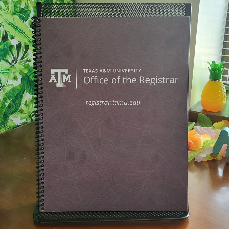 Cover of a spiral-bound notebook featuring the Texas A&M University logo and text for the Office of the Registrar.